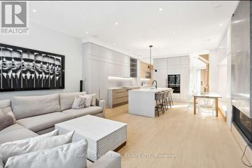 Toronto (Rosedale-Moore Park) apartment for rent - A modern living room with a large painting on the wall and a dining area in the background.