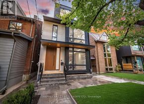Toronto (Rosedale-Moore Park) apartment for rent - A modern house with a wooden front door is for sale.