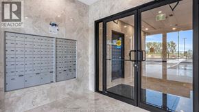 Windsor condo for rent - A realtor office with a glass door and a sign on the wall.