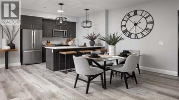 Windsor condo for rent - A modern kitchen with a dining table set for two.