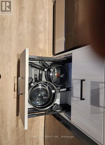 Toronto (Junction Area) condo for rent - A stainless steel pot sits on a stove in a modern kitchen.