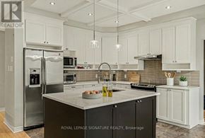 Ottawa apartment for rent - A modern kitchen with a large island and stainless steel appliances.