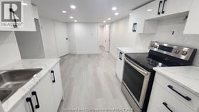 Windsor apartment for rent - A modern kitchen with white cabinets and stainless steel appliances.