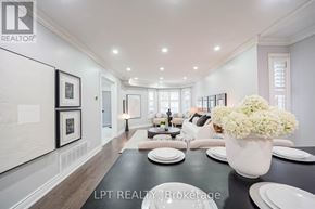 Markham (Middlefield) apartment for rent - A dining room with a table set for two and a vase of flowers.