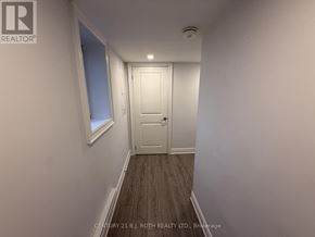 Barrie (Ardagh) apartment for rent - A hallway with a door and a window.