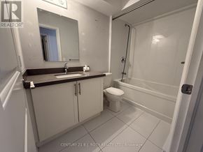 Barrie (Ardagh) apartment for rent - A bathroom with a toilet, sink, and bathtub.