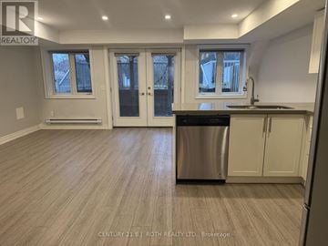 Barrie (Ardagh) apartment for rent - A kitchen with a dishwasher and cabinets.