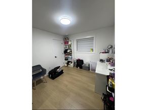 Surrey apartment for rent - A room with a lot of items on the floor and shelves.
