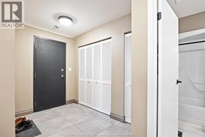 Windsor condo for rent - A black door is in a room with a white door to the right.