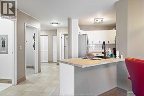 Windsor condo for rent - A realtor's office with a desk and a chair.