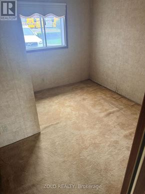 Toronto (Alderwood) apartment for rent - A room with a window and a carpeted floor.