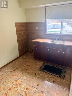 Toronto (Alderwood) apartment for rent - A bathroom with a sink and a window.