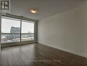 Kitchener condo for rent - A room with a view of the city through the windows.