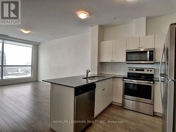 Kitchener condo for rent - A kitchen with a refrigerator, microwave, oven, and sink.