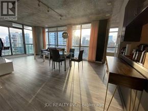 Toronto (Church-Yonge Corridor) condo for rent - A modern dining room with a view of the cityscape.