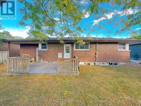St. Catharines (Glendale/Glenridge) apartment for rent - A house with a wooden fence in front of it.