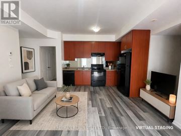 Mississauga (Churchill Meadows) townhouse for rent - A modern living room with a grey sofa and a coffee table in the center.