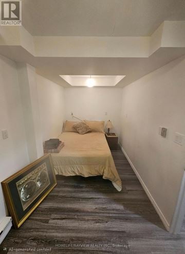Aurora (Aurora Highlands) apartment for rent - A bedroom with a bed and a picture frame on the floor.