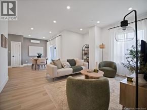 Moncton apartment for rent - A well-lit, modern living room with a variety of seating options and a dining area in the background.