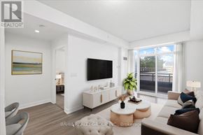 Toronto (Etobicoke West Mall) condo for rent - A living room with a flat screen TV mounted on the wall.
