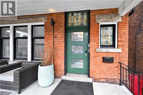 Hamilton apartment for rent - A green door with a glass window is the main focus of the image.
