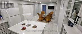 Markham (Raymerville) apartment for rent - A modern kitchen with a dining table set for two.