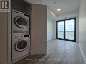 Toronto (Bayview Village) condo for rent - A washer and dryer are in a small closet.