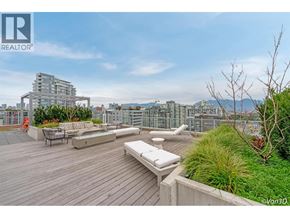Vancouver apartment for rent - A rooftop patio with a bench and a table.