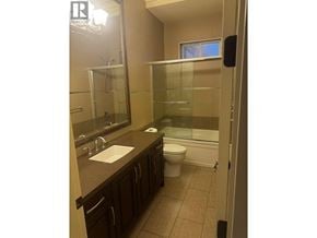 Richmond apartment for rent - A bathroom with a sink, toilet and bathtub.