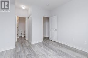Clarington (Bowmanville) condo for rent - A room with a toilet and a door is shown.