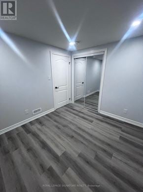 Oshawa (Taunton) apartment for rent - A room with a white door and a white wall.