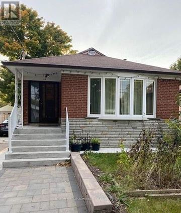 Toronto (Wexford-Maryvale) apartment for rent - A small house with a porch and a front yard.