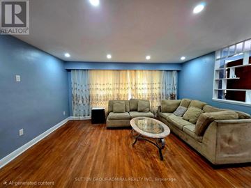 Toronto (Wexford-Maryvale) apartment for rent - A living room with a brown sofa and a glass coffee table.