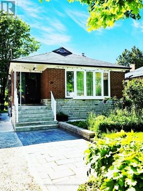 Toronto (Wexford-Maryvale) apartment for rent - A house with a brick facade and a white door.