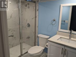 Markham (Cedarwood) apartment for rent - A bathroom with a toilet, sink, and shower with a marble floor.