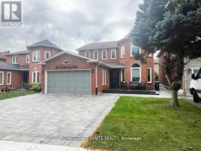 Toronto (Rouge) apartment for rent - A large brick house with a garage is for sale.