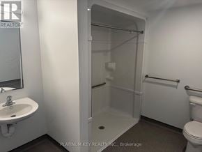 Strathroy-Caradoc (Mount Brydges) townhouse for rent - A bathroom with a sink, toilet, and shower.