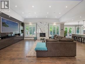 Halton Hills (Rural Halton Hills) apartment for rent - A living room with a brown couch and a television.