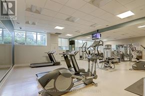 Richmond Hill (Doncrest) condo for rent - A gym with a variety of equipment including treadmills, elliptical machines, and weight machines.