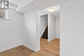 Toronto (Eringate-Centennial-West Deane) apartment for rent - A room with a staircase leading to another room.