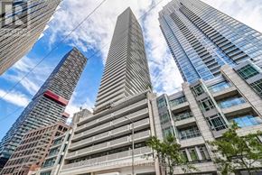 Toronto (Mount Pleasant West) condo for rent - A tall building with the words "Forest Hill Residential Inc." on its facade is seen from a low angle.