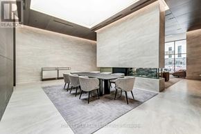 Toronto (Mount Pleasant West) condo for rent - A modern dining room with a glass table and chairs.