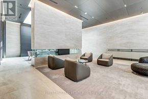Toronto (Mount Pleasant West) condo for rent - A modern waiting area with brown and grey furniture.