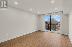 Ottawa apartment for rent - A room with a sliding glass door leading to a balcony.