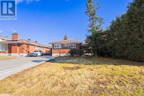 Ottawa apartment for rent - A house with a lawn in front of it.