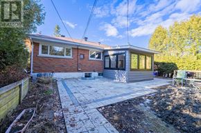 Ottawa apartment for rent - A house with a patio and a garden.