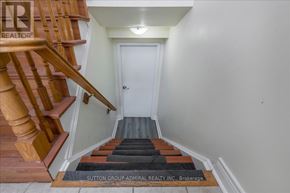 Barrie (Holly) apartment for rent - A hallway with a staircase leading to the second floor.