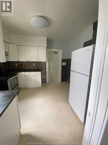 Windsor apartment for rent - A kitchen with white cabinets and a white refrigerator.