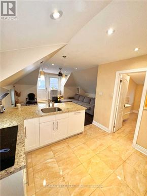 Toronto (Yonge-Eglinton) apartment for rent - A kitchen with a sink and cabinets under a window.