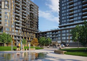 Burlington (Alton) condo for rent - A large building with a fountain in front of it.